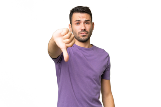 Young handsome caucasian man over isolated background showing thumb down with negative expression