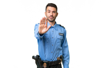 Young police caucasian man over isolated background making stop gesture