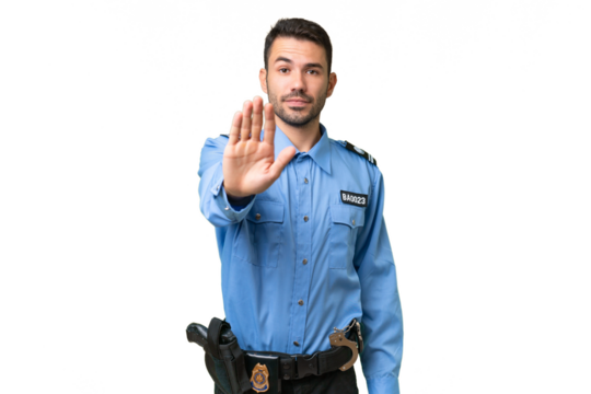 Young police caucasian man over isolated background making stop gesture