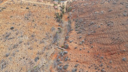 desert place where the scarce vegetation meets the mountains and the sand 