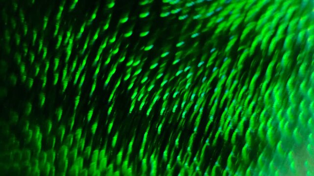 a mesmerizing in motion, abstract pattern of green light creating a sense of depth, a series of concentric, wavy lines that create a hypnotic, almost three-dimensional effect, movement and energy