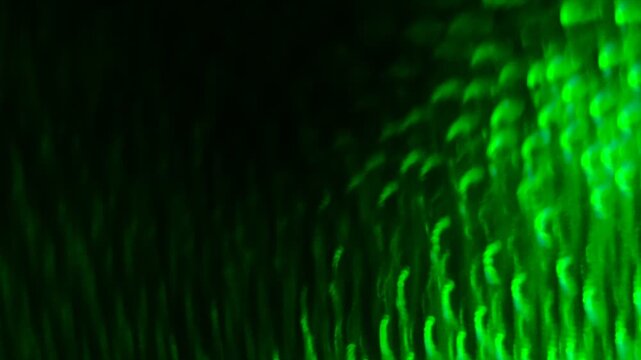 a mesmerizing in motion, abstract pattern of green light creating a sense of depth, a series of concentric, wavy lines that create a hypnotic, almost three-dimensional effect, movement and energy