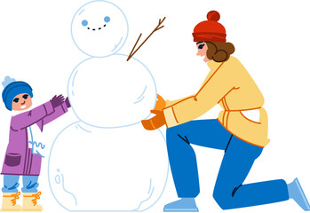 Mother and daughter building snowman together in winter