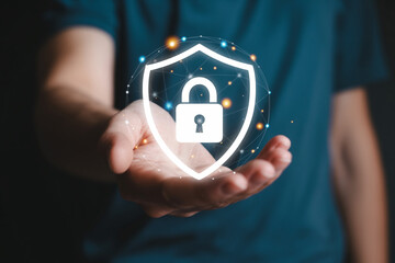 Person holding glowing shield and lock symbolizing data privacy and protection