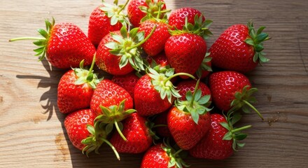 Fresh ripe strawberries on wooden background highlighting natural vibrancy