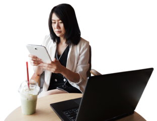 Professional Asian businesswoman in white suit working with laptop and tablet on wooden table