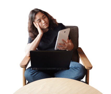 Smiling Asian young businesswoman is holding tablet for online shopping in social media for relaxing on armchair. Lifstyle of people with technology concept - Powered by Adobe