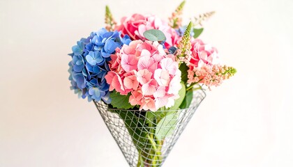 Obraz premium A bouquet of hydrangeas in a cone vase