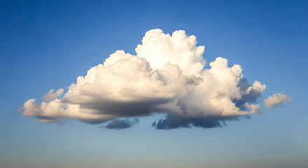 Majestic cumulonimbus cloud ascends into a brilliant blue sky capturing sunlight and dramatic atmospheric beauty