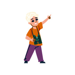 Curious boy exploring nature with binoculars and pointing finger