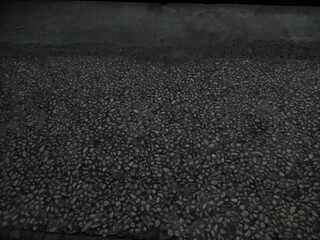 floor with a background of neatly arranged small stones