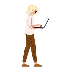 Young woman walking and working on laptop, side view