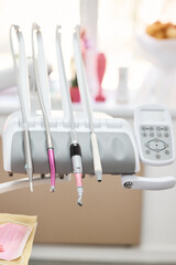 Dental tools on a unit, ready for use in a bright and well-equipped dental office.