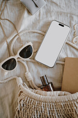 Eco Mesh Bag, Neutral Sunglasses, and Smartphone on Light Fabric Background, Relaxed Vibes