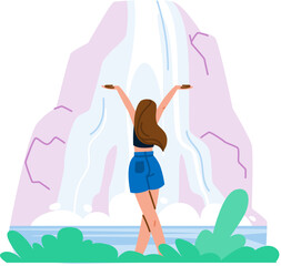Tourist enjoying majestic waterfall in natural landscape