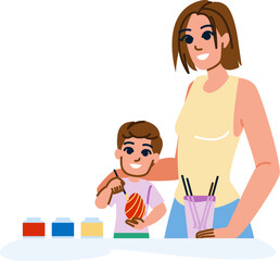 Mother and son painting easter eggs together at home
