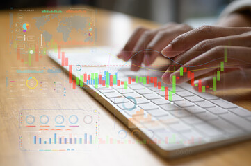 Hands typing on keyboard and working with trading chart in concept of market analysis financial and...