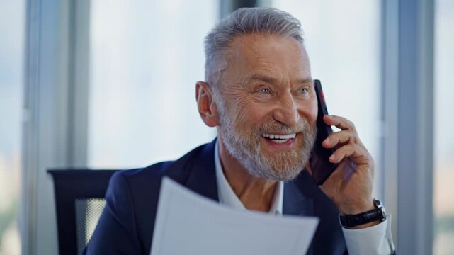 Businessman discussing document mobile phone enjoy deal in office closeup.