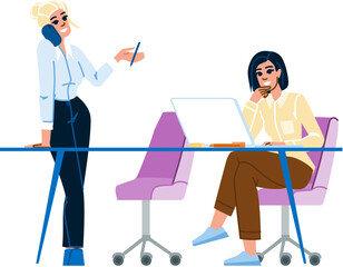 Businesswomen working together in office discussing project on phone and laptop