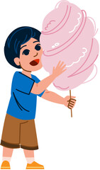 Happy child eating pink cotton candy on white background