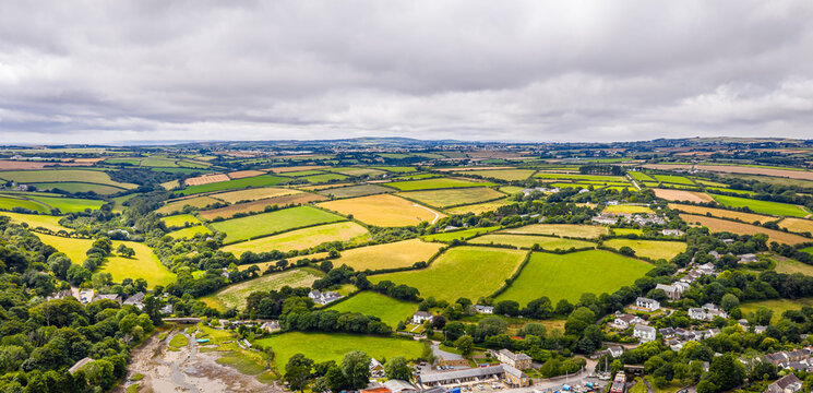 Aerial view of Gweek village with surrounding green fields and countryside