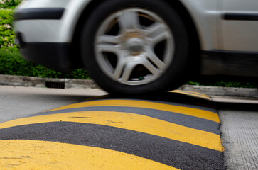 city car speed limit , speed bump on road to reduce fast car
