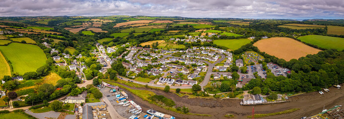 Aerial view of Gweek village with surrounding green fields and countryside