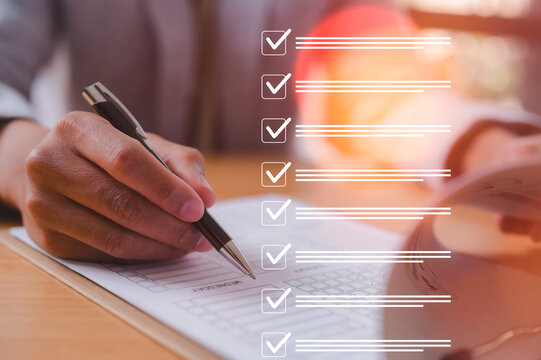 Hand writing checklist on notebook with digital task list overlay symbolizing productivity, task management, planning, organization, goals, workflow, business strategy, and efficiency.