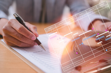 Time management project planning staff working hours concept, Project manager using pen write update tasks and milestones progress planning with Gantt chart scheduling interface on a virtual screen