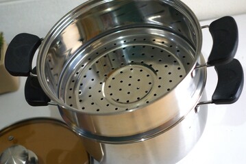 Stainless steel Steamer pot with perforated insert for cooking