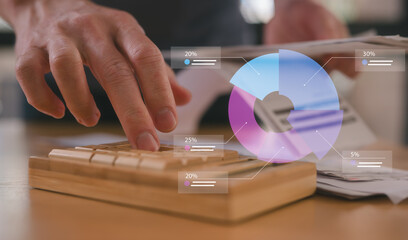Close-up of a hand operating a wooden calculator while holding bills, symbolizing personal finance, budgeting, expense tracking, savings, accounting, eco-conscious living, and money management