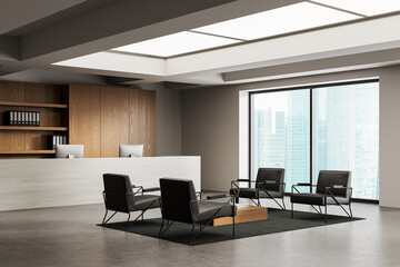 Modern office reception interior with sleek furniture, wooden accents, and city view through large...