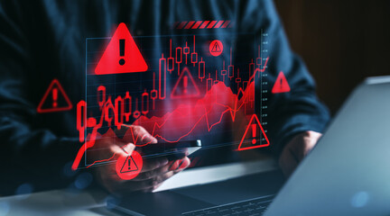 Stock market crash warning concept with digital red alert symbols and financial chart overlays on dark background showing economic downturn risk.