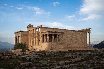 Fototapeta premium The Caryatides, female statues in the Acropolis of Athens, Greece, against a summer sky