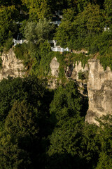 Scenic view of lush greenery and rocky cliffs showcasing natural beauty, inviting exploration and adventure in a tranquil outdoor setting. Kamianets-Podilskyi, Ukraine