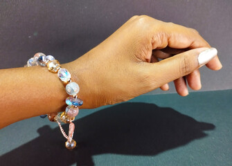 Hand Wearing Elegant Beaded Crystal Charm Bracelet