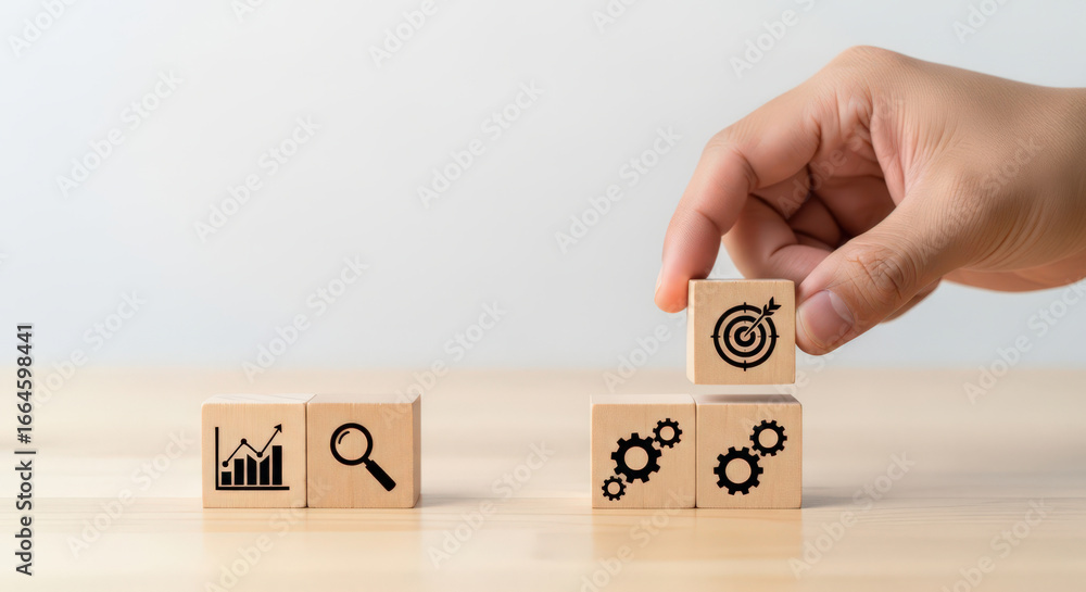 Aufkleber strategic goal setting and process optimization depicted through wooden blocks with business icons r