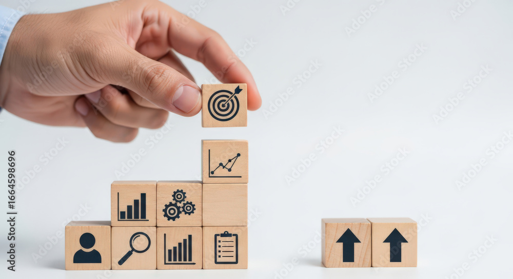 Poster building blocks to success a hand placing a target block on a stack representing growth strategy and