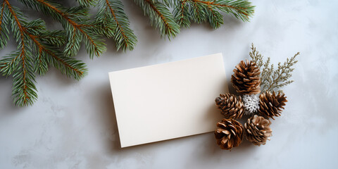 Christmas card preparation with pine cones and greenery holiday decor cozy indoor setting aerial view