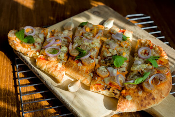 Close Up of Rustic Gourmet Pizza Naan Bread Slices with Garlic, Shallots, Italian Homemade Food