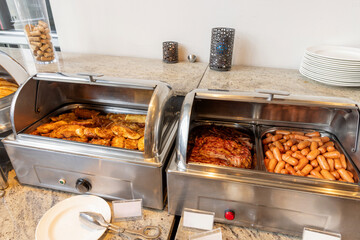 Selection of breakfast foods arranged on a hotel buffet table