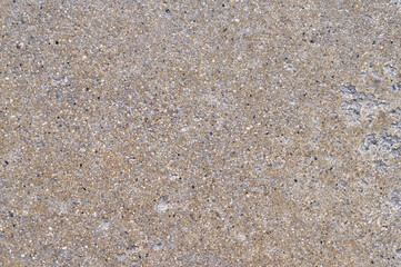 Close Up View of Textured Concrete with Small Gravel Particles Embedded Showing a Coarse Aggregate Surface