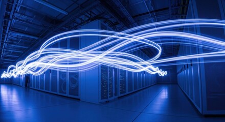 Abstract light trails flowing through a modern dark blue server room. Digital data stream visualization for big data processing concept.