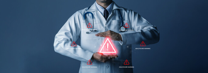 Doctor holding virtual healthcare warning icon. Medical risk alert, notification patient safety issue, emergency care or system failure in digital health technology. Doctor monitoring patient 24 hour.