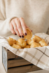 Hand Picking Pastry from Basket