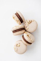 Elegant chocolate macarons with nuts