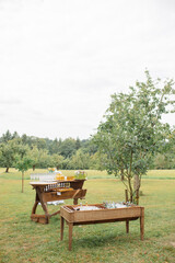 Rustic Outdoor Drink Station with Wooden Tables