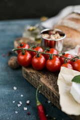 Fresh Cherry Tomatoes on Rustic Wooden Board