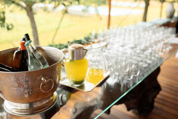 Elegant Outdoor Bar Setup with Wine and Juice