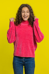 Happy joyful Caucasian girl celebrating success victory, winning birthday, lottery jackpot goal...